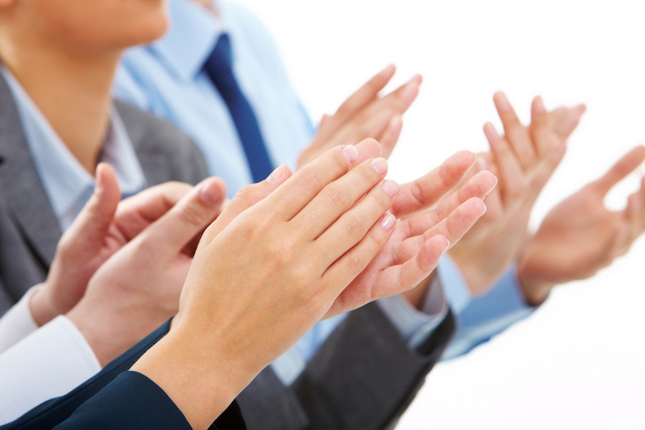 Photo of business partners hands applauding at meeting